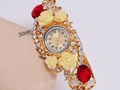 Женский браслет-часы с цветами и камнями