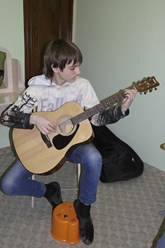 Обучение игре на гитаре.
