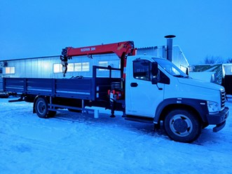Бортовой автомобиль Газон Нкст с краном-манипулятором.