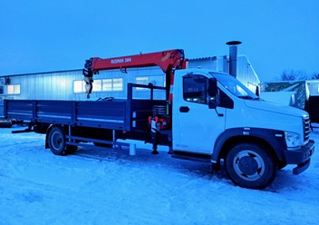 Бортовой автомобиль Газон Нкст с краном-манипулятором.
