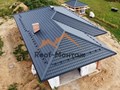 Успешно выполнили устройство четырехскатной крыши под ключ из металлочерепицы.
