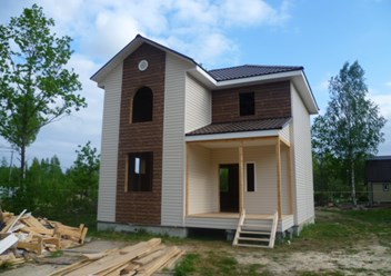 Каркасный дом с отделкой фасадными панелями
