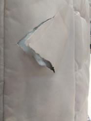 Порыв на кожаном пуховике.