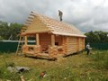 Сруб бани в чашу с рубленой верандой