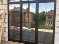 Деревянное окно со стеклопакетом из клеёного бруса массива сосны, с раскладкой внутри стеклопакета.