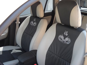 Chery Tiggo. Перетяжка сидений кожей. Вышивка на спинках сидений.