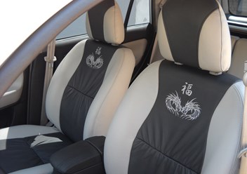 Chery Tiggo. Перетяжка сидений кожей. Вышивка на спинках сидений.