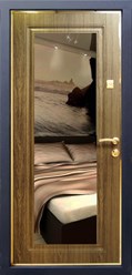 Ригоросо Блик– входная дверь благородного цвета – темного дуба, интересная художественная фрезеровка, отделку завершили патинированием