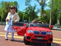 Девочка Даша на автомобиле бмв для детей